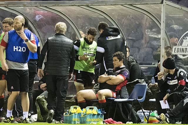 A gloomy Phil Burleigh, centre, sits in the BT Murrayfield dugout after receiving his red card  for striking on Saturday. The centre received a one-match ban yesterday, while his victim Pascal Pape was warned for what was deemed to be exaggerating the incident.
