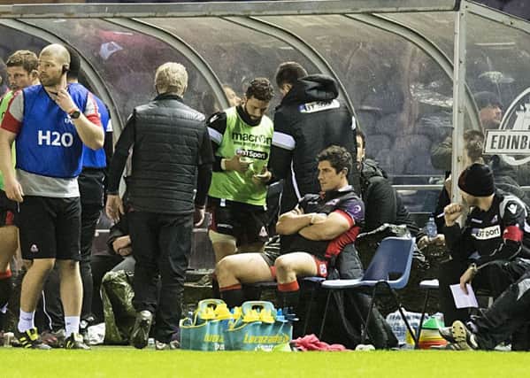 A gloomy Phil Burleigh, centre, sits in the BT Murrayfield dugout after receiving his red card  for striking on Saturday. The centre received a one-match ban yesterday, while his victim Pascal Pape was warned for what was deemed to be exaggerating the incident.
