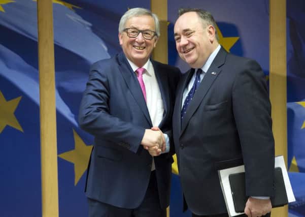 Jean-Cluade Juncker greets Alex Salmond in Brussels. Picture: AP/Virginia Mayo