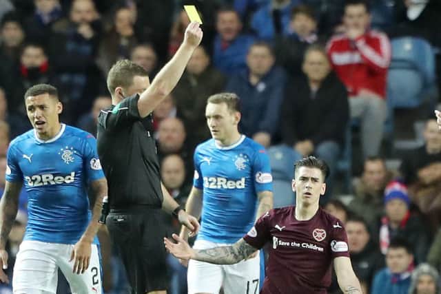 A nonplussed Jamie Walker as he's shown the yellow card by referee John Beaton. Picture: PA
