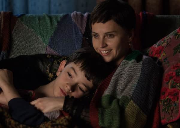 Lewis MacDougall with Felicity Jones in A Monster Calls