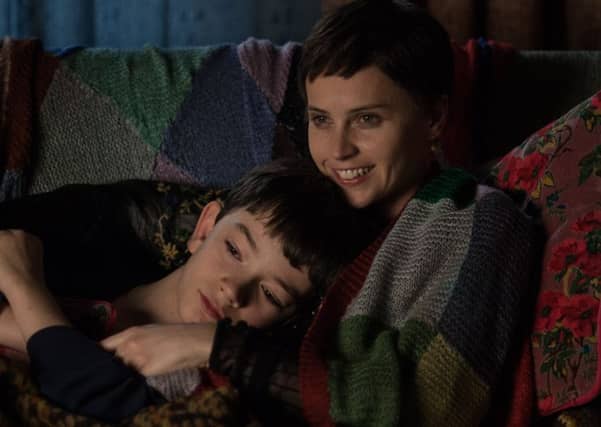 Lewis MacDougall with Felicity Jones in A Monster Calls