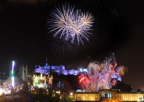 Fireworks above Edinburgh Castle and Princes Street during the New Year celebrations. Now the council is investigating the use of silent fireworks. Picture Jane Barlow
