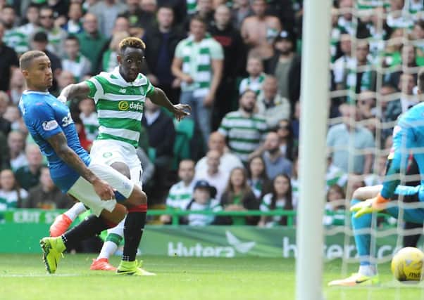 Moussa Dembele fires the ball through the legs of Wes Foderingham during the first Old Firm derby of the 2016/17 season. Picture: John Devlin