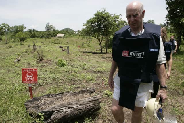 Sir Bobby Charlton, founder of the Find A Better Way charity, visits a mine clearence 
site in Battambang in Cambodia. Picture: Dimas Ardian/Getty