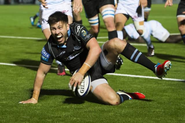 Ali Price celebrates after scoring Glasgow Warriors' third try in the win over Racing. Picture: Paul Devlin/SNS