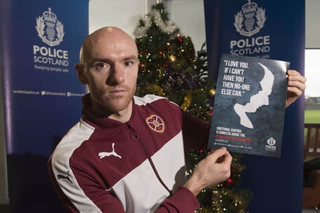 Hearts striker Conor Sammon helps promote Police Scotland's anti-domestic abuse campaign. Picture: Alan Harvey/SNS