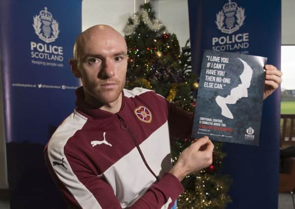 Hearts striker Conor Sammon helps promote Police Scotland's anti-domestic abuse campaign. Picture: Alan Harvey/SNS