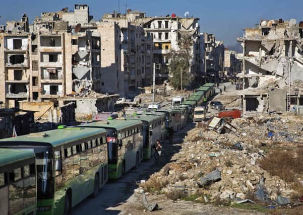 Buses stand idle as an evacuation operation for rebel fighters and their families from Aleppo stalls. Picture: AFP