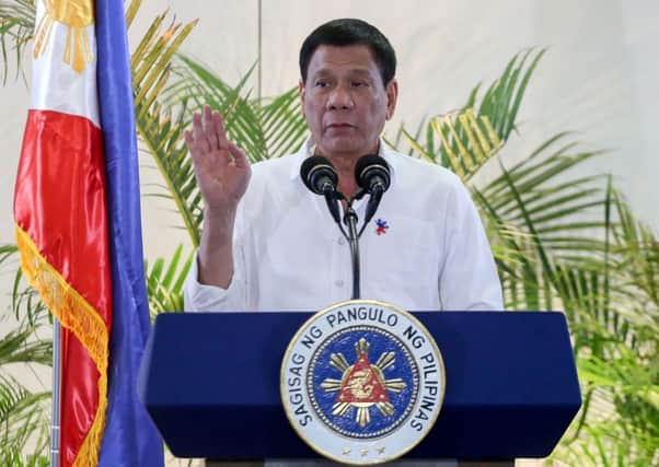 Duterte gives a press conference on arrival at Davao. Picture: AFP/Getty Images
