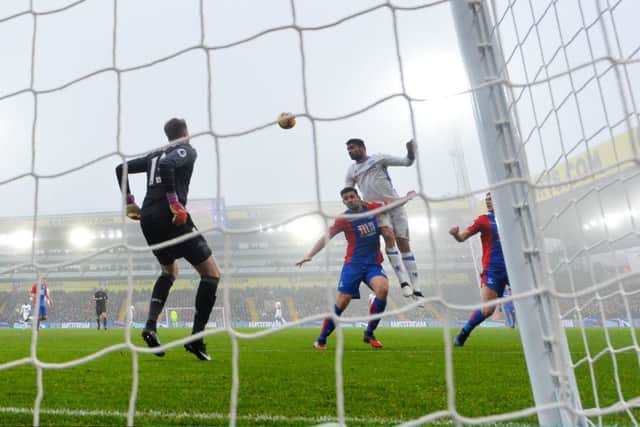 Diego Costa jumps highest at a foggy Selhurst Park to head home his 13th league goal of the season. Picture: Dan Mullan/Getty