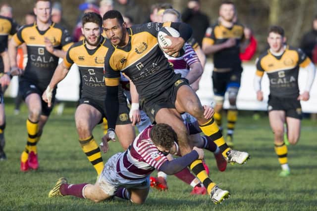 Currie tryscorer Ratu Tagive is tackled by Watsonians Jack Ferguson. Photograph: Ian Rutherford