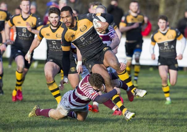 Currie tryscorer Ratu Tagive is tackled by Watsonians Jack Ferguson. Photograph: Ian Rutherford