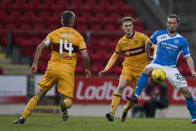 Motherwell's David Ferguson (left) and St Johnstone's goalscorer Chris Kane during the 1 - 1 draw at McDiarmid Park. Pitcure: Kenny Smith/SNS