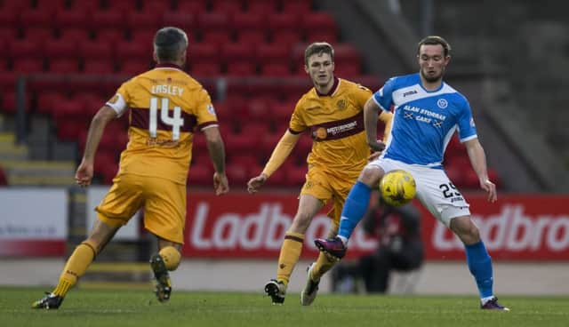 Motherwell's David Ferguson (left) and St Johnstone's goalscorer Chris Kane during the 1 - 1 draw at McDiarmid Park. Pitcure: Kenny Smith/SNS