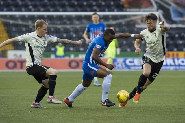 Inverness' Carl Tremarco (left) and Brad McKay (right) try to halt Kilmarnock goalscorer Souleymane Coulibaly. Picture: Gary Hutchison/SNS