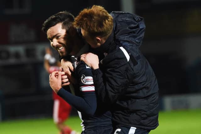 Ross County's match-winner Ryan Dow (left) with teammate Tony Dingwall at full time in their 2-1 victory over Aberdeen. Pitcure: Rob Casey/SNS