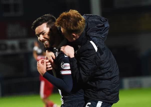 Ross County's match-winner Ryan Dow (left) with teammate Tony Dingwall at full time in their 2-1 victory over Aberdeen. Pitcure: Rob Casey/SNS