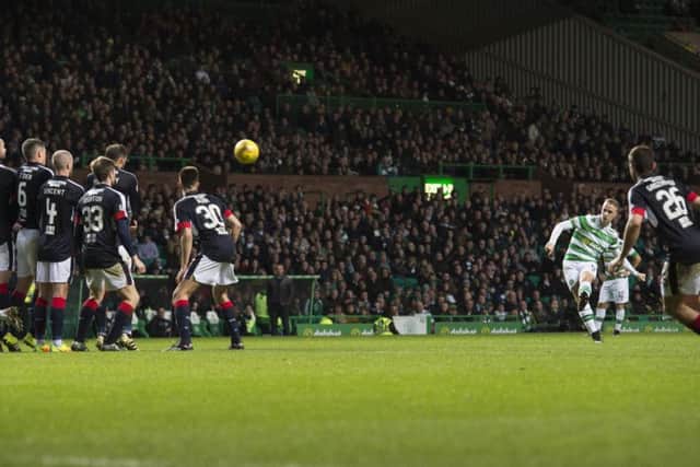 Celtic's Leigh Griffiths scores the opening goal against Dundee. Picture: SNS.