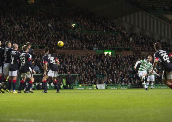 Celtic's Leigh Griffiths scores the opening goal against Dundee. Picture: SNS.