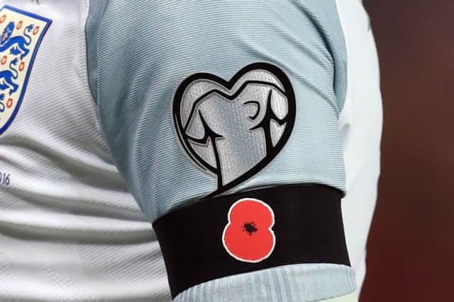 Wayne Rooney's black armband with a poppy on during the 2018 FIFA World Cup qualifying against Scotland. Picture: PA