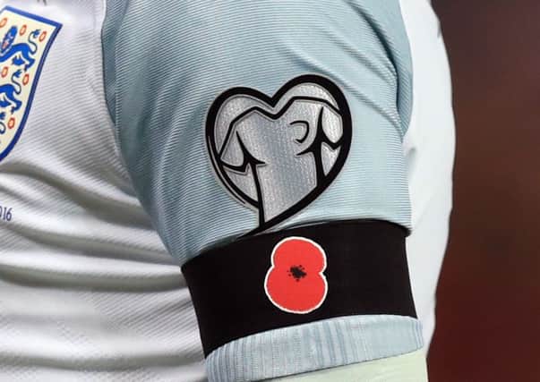 Wayne Rooney's black armband with a poppy on during the 2018 FIFA World Cup qualifying against Scotland. Picture: PA