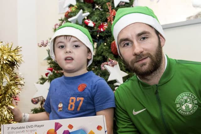 James Keatings was among members of the Hibernian squad who visited to the Royal Hospital for Sick Children. Picture: SNS.