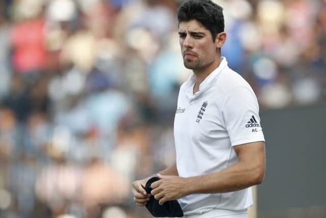 England captain Alastair Cook walks off the field after his side suffered an innings defeat by India in the fifth Test in Chennai. Picture: AP Photo/Tsering Topgyal