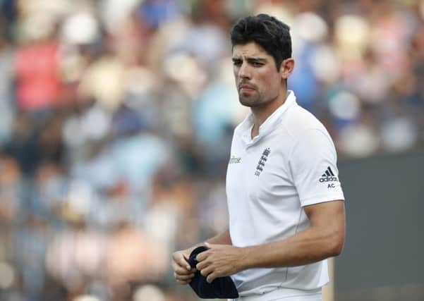 England captain Alastair Cook walks off the field after his side suffered an innings defeat by India in the fifth Test in Chennai. Picture: AP Photo/Tsering Topgyal