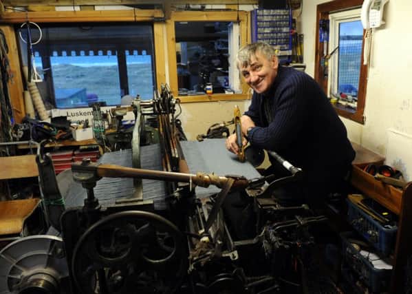 Donald John MacKay a Harris tweed weaver, at his workshop on the Isle of Harris in 2011. Picture: Robert Perry/TSPL