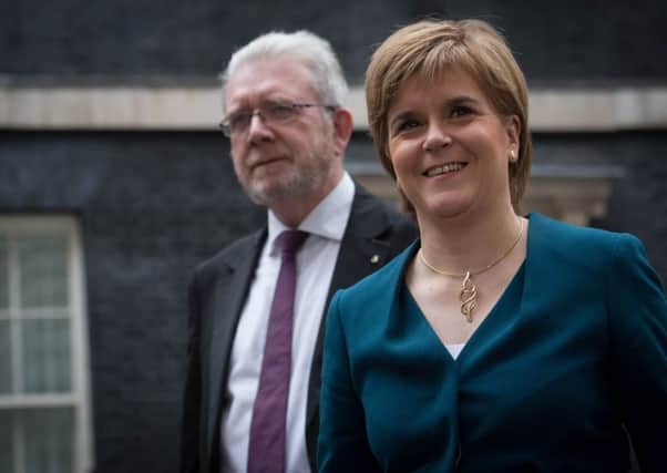 Nicola Sturgeon with Brexit minister Michael Russell. Picture: PA