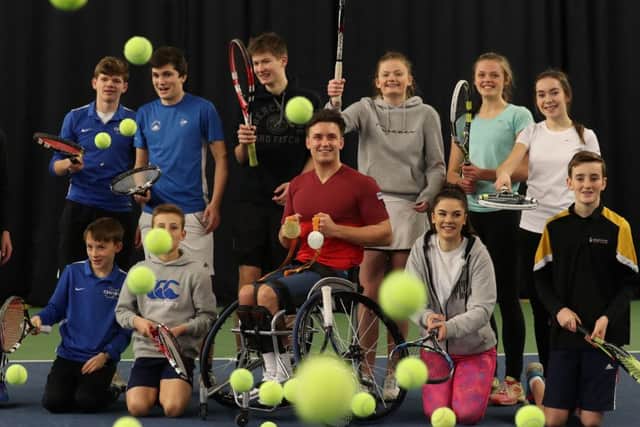 Paralympic, Wimbledon, Australian Open champion and Wheelchair Singles World Number One Gordon Reid with children from Dunblane High School at Gannochy National Tennis Centre, Stirling. Picture: Andrew Milligan/PA Wire.