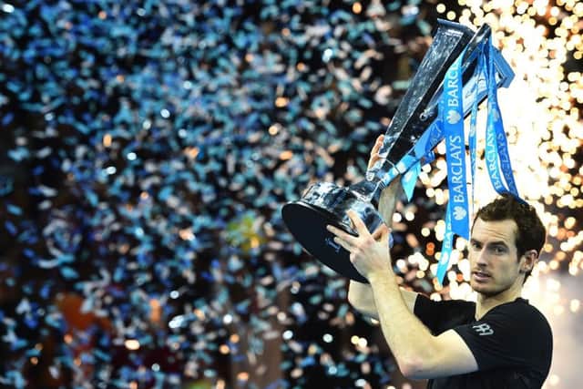 Andy Murray celebrates with the trophy after winning the ATP World Tour Finals  in London last month. Picture:  Glynn Kirk/Getty Images