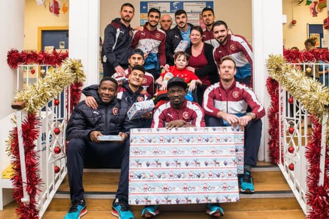 Hearts players met 12-year-old Denver Caven, centre, during their visit to the Royal Hospital for Sick Children. Picture: Ian Georgeson.