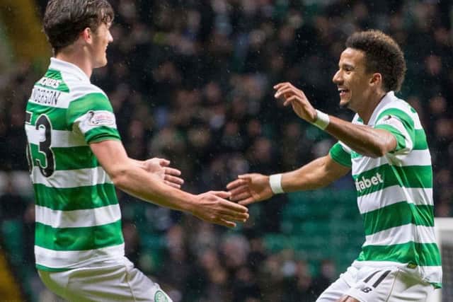 Celtic matchwinner Scott Sinclair, right, celebrates his goal against Partick with Liam Henderson. Picture: Jeff Holmes/PA Wire.