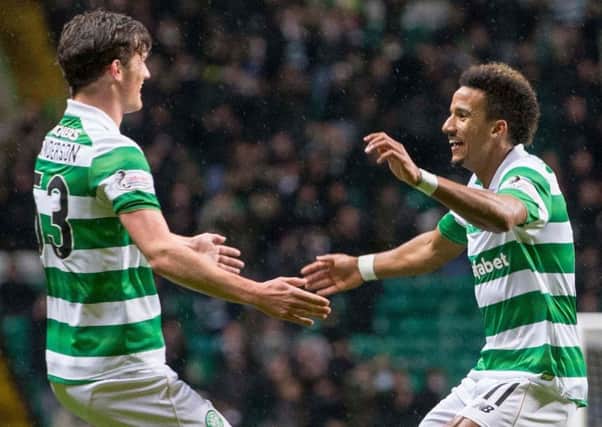 Celtic matchwinner Scott Sinclair, right, celebrates his goal against Partick with Liam Henderson. Picture: Jeff Holmes/PA Wire.