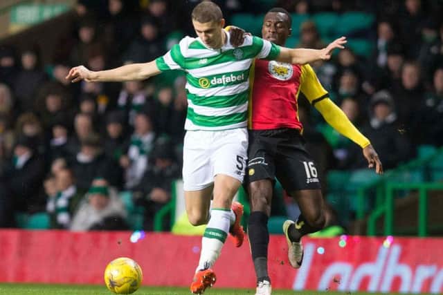 Celtic's Jozo Simunovic in action against Partick Thistle's Adebayo Azeez on Tuesday. Picture: Jeff Holmes/PA Wire