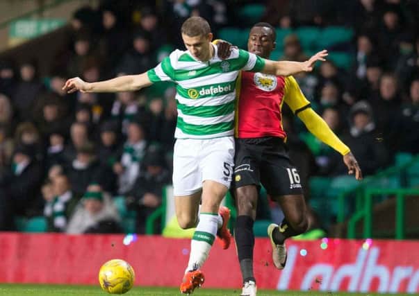Celtic's Jozo Simunovic in action against Partick Thistle's Adebayo Azeez on Tuesday. Picture: Jeff Holmes/PA Wire
