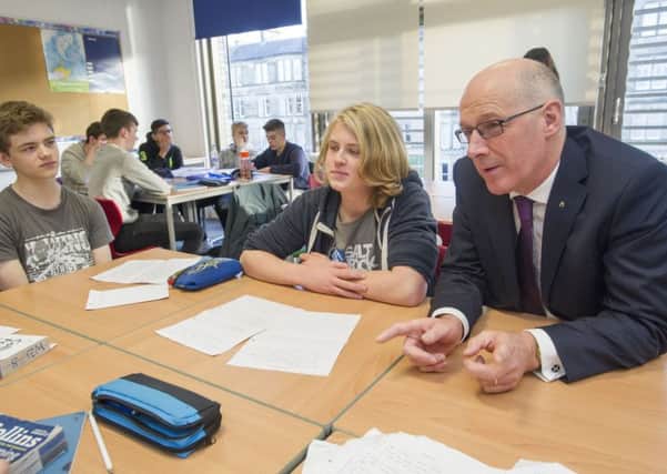 Education Secretary John Swinney speaks to pupils at James Gillespie's High School in Edinburgh.

Picture Ian Rutherford