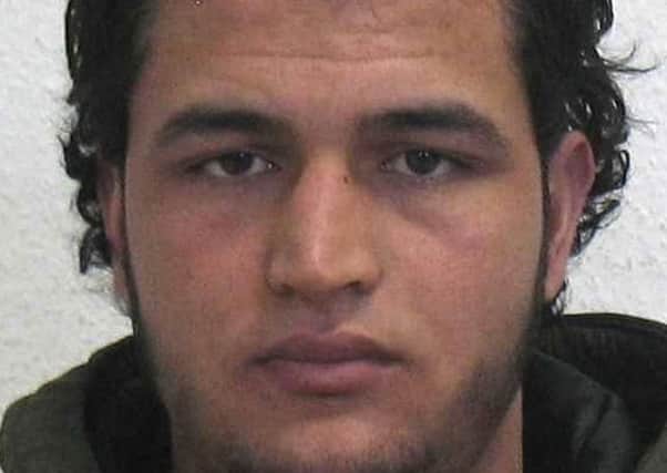 Tunisian Anis Amri, 24, is suspected of being involved in the fatal attack on the Christmas market in Berlin. Picture: German police via AP