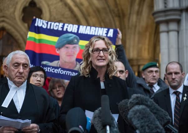 Claire Blackman, the wife of imprisoned marine Alexander Blackman, speaks to the media with a lawyer after his bail was refused during a hearing at the Royal Courts of Justice. Picture: Getty Images