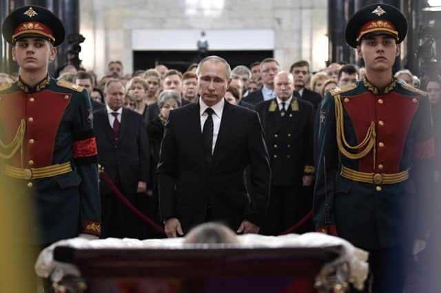 Russian president Vladimir Putin at the lying in state of murdered ambassador Andrei Karlov. Picture: AFP/Getty Images