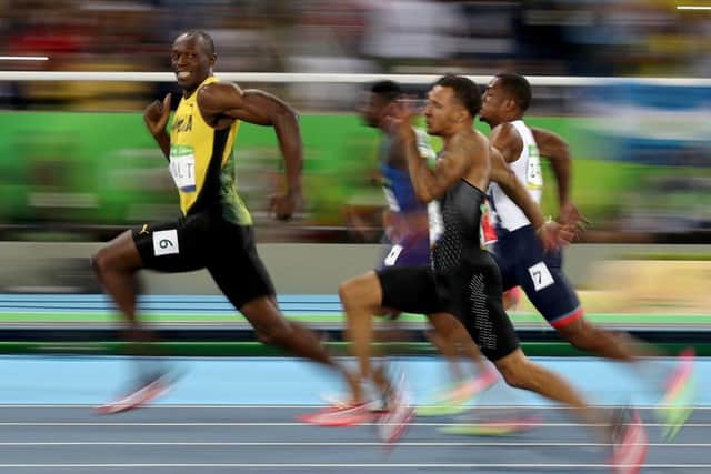 Usain Bolt leads his 100m semi-final on his way to a triple triple of 100m, 200m and relay golds at three Olympic Games. Picture: Cameron Spencer/Getty Images