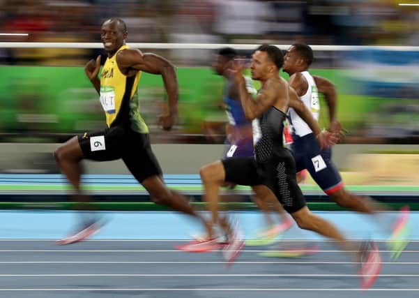 Usain Bolt leads his 100m semi-final on his way to a triple triple of 100m, 200m and relay golds at three Olympic Games. Picture: Cameron Spencer/Getty Images
