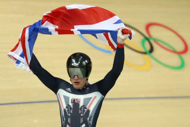 Callum Skinner celebrates after helping Britain win gold in the men's team sprint at Rio's Olympic Velodrome. Picture: Bryn Lennon/Getty Images