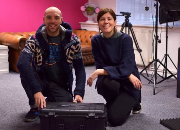 Stephen Noble and Lindsey Carr of Equator with their boxed digital classroom