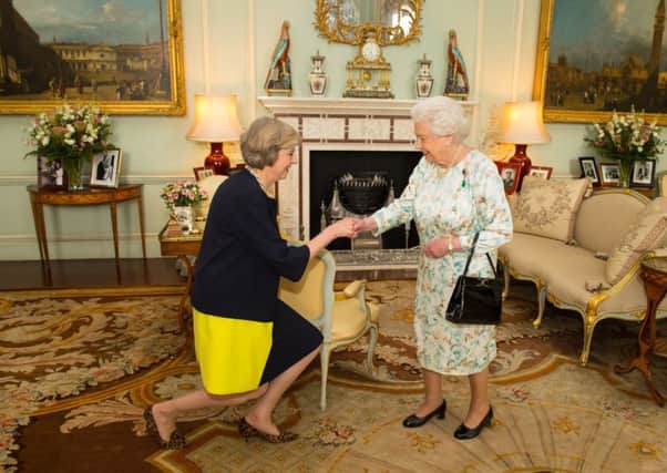 File photo of Theresa May with the Queen. Picture: PA