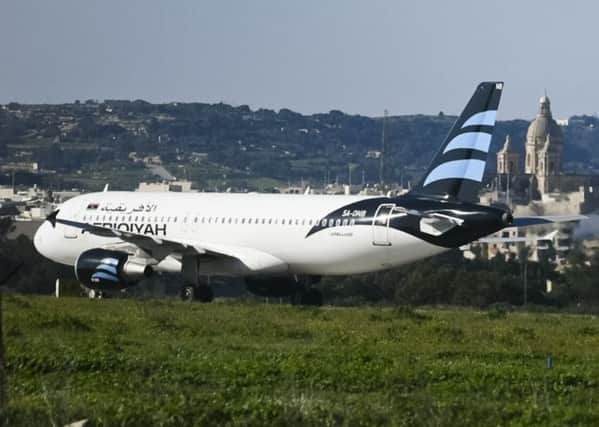 The Afriqiyah Airways plane stands on the tarmac at Malta's Luqa International airport. Picture: Jonathan Borg/AP