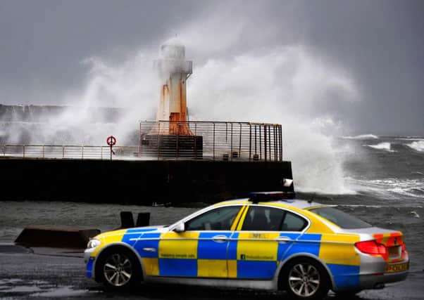 Police sit at Ardrossan Harbour as the storm rages. (Photo by Jeff J Mitchell/Getty Images)