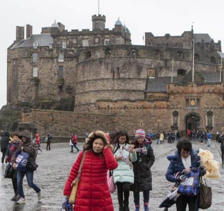 Edinburgh Castle is closed due to safety concerns from he high winds as Storm Barbara hits much of the U.K. The Met office have issued a weather warning for severe gales and heavy rain which will affect the north-west from the start. The wet and very windy weather will spread south and east across the country later in the day, but become less severe.